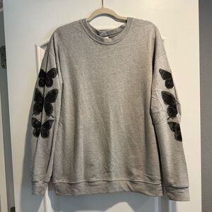 Gray Sweatshirt with Black Butterfly Design